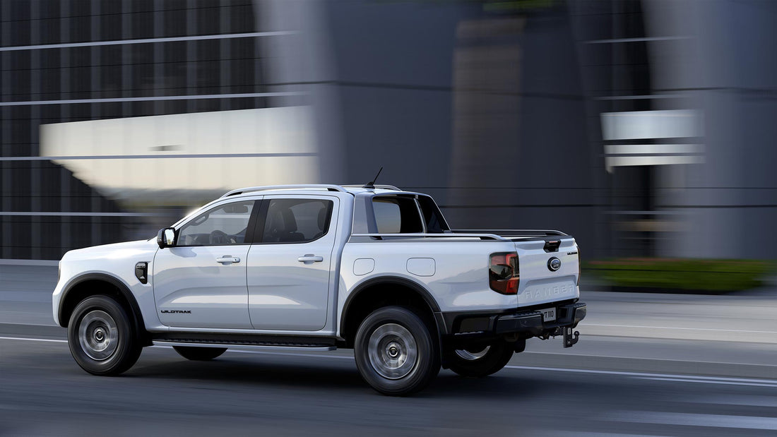 2024 Ford Ranger XLT cruising on a highway, showcasing its sleek new design and powerful performance, ideal for both urban and off-road adventures.