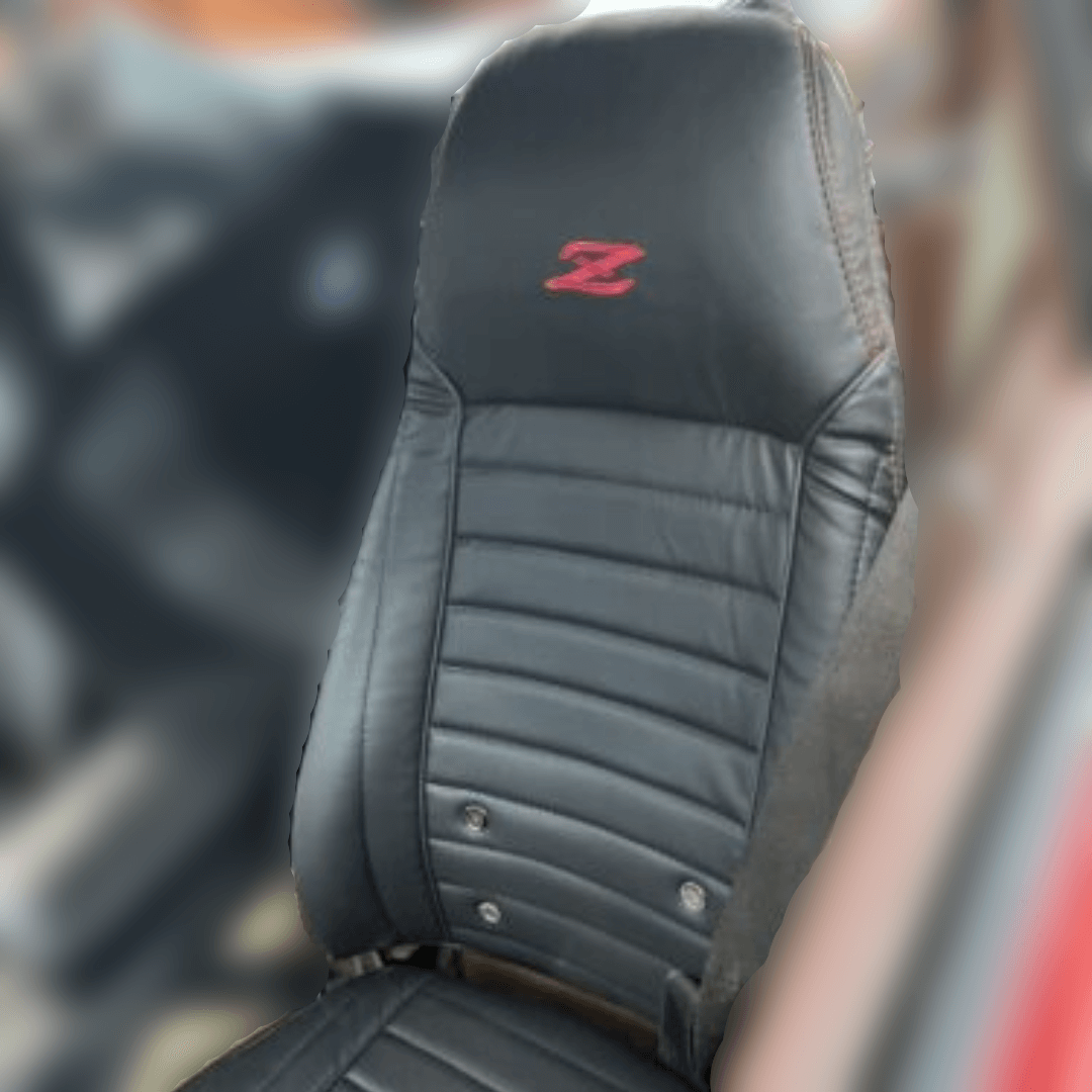 Premium black leather seat cover with a red embroidered 'Z' emblem, fitted on a Datsun 240Z 260z 280z from the 1970s, showcasing enhanced cushioning and detailed stitching.