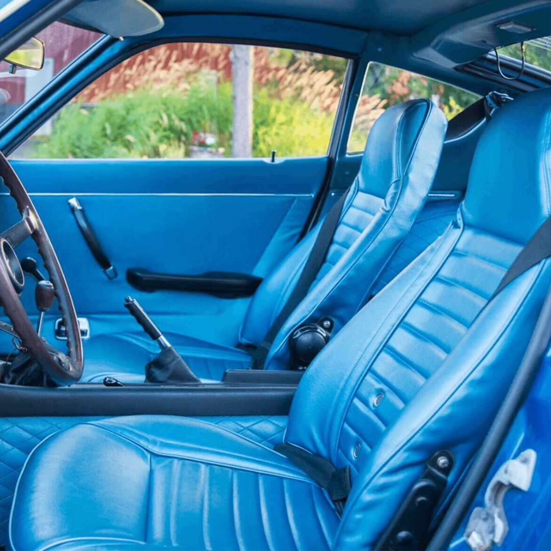 Blue synthetic leather seat covers designed for Datsun 240Z, 260Z, and 280Z models from 1970-1978. These covers offer a perfect fit, enhancing the car's interior with a touch of luxury while providing durable protection against spills and wear.