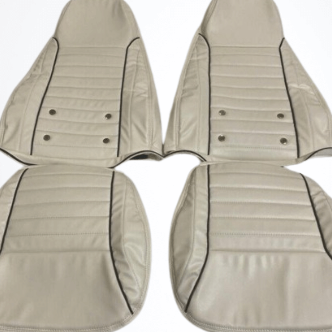 Datsun 240Z, 260Z, and 280Z synthetic leather seat covers for 1970-1978 models in white. The seat covers are designed to fit perfectly, providing a clean and stylish upgrade to the vehicle's interior. Made from high-quality synthetic leather, they offer a luxurious appearance and durable protection against spills, stains, and wear.