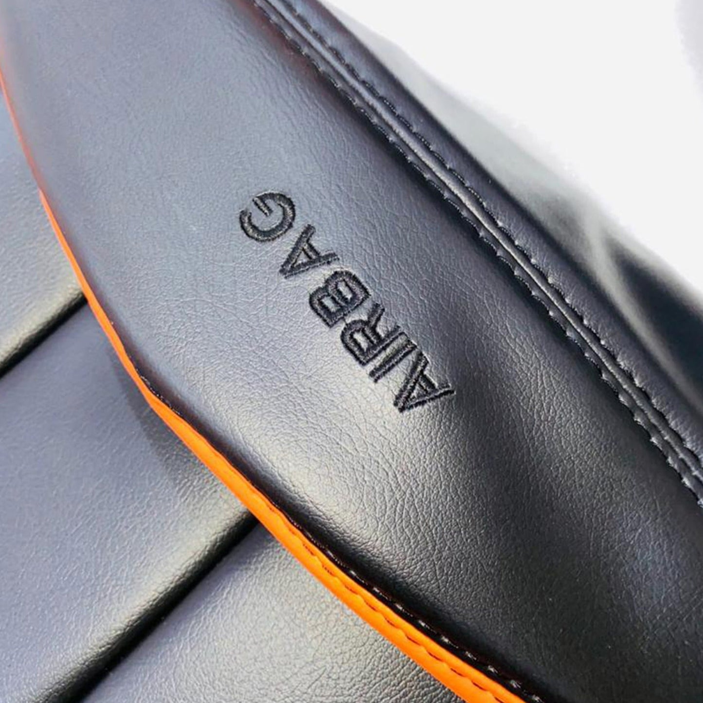 Corvette C6 Seat Covers - Orange & Black - Lux Seat CoversFront and detailed views of Corvette C6 black and orange faux leather seat covers. The covers feature a dynamic design with vibrant orange panels and black accents, along with detailed stitching and ergonomic contours. The Corvette logo is prominently displayed on the headrests, enhancing the bold and sporty aesthetic of the car's interior.