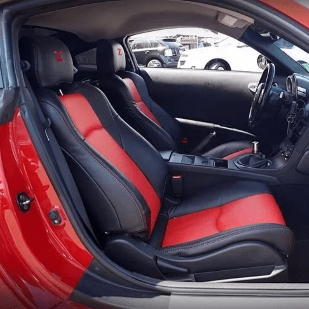 Detailed view of Nissan 350Z red and black seat covers, highlighting the luxurious leather finish and precise craftsmanship, designed for the 2003-2008 model.