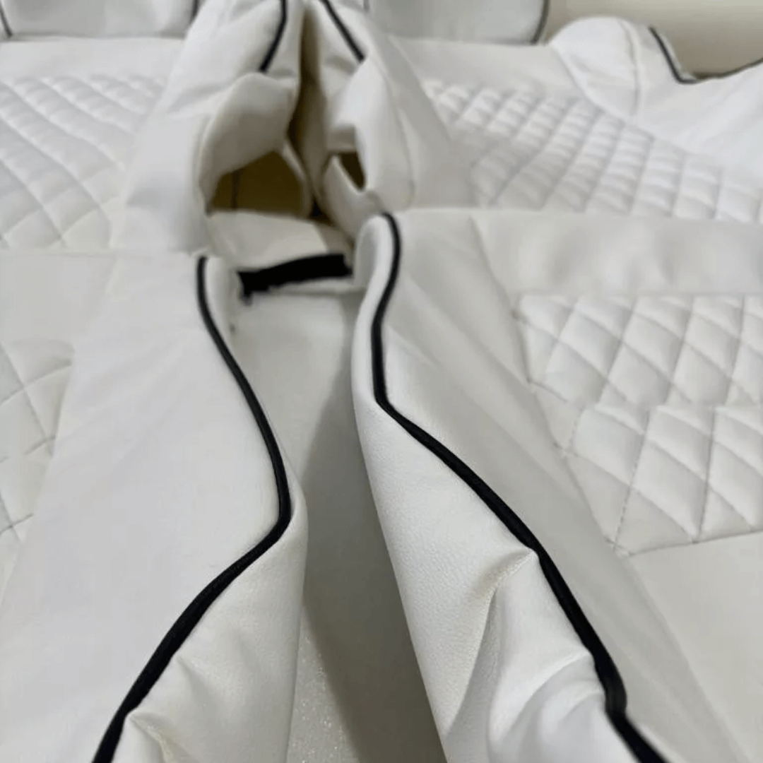 Precision-crafted white leather seat covers with diamond stitching and black piping for Nissan 350Z, showcasing a seamless design for the 2003-2008 models.