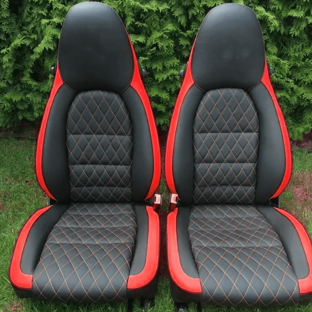 Custom Porsche Boxster 986 (1997-2004) seat covers in black and yellow leather with a diamond pattern and yellow stitching, designed for a bold and luxurious interior upgrade.