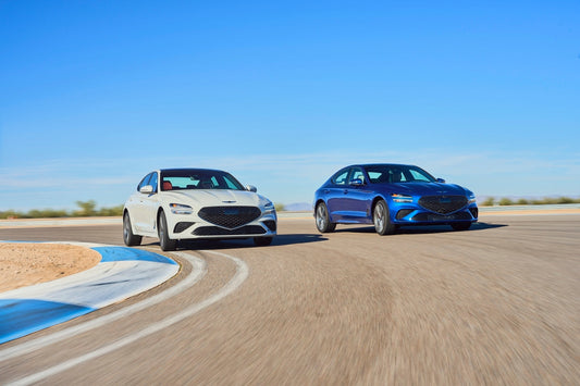 2024 Genesis G70 parked on a city street, showcasing its sleek design and powerful 2.5L turbocharged engine, epitomizing compact luxury performance.