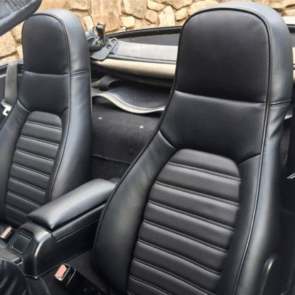 Custom-fit black leather seat covers for Mazda Miata MX-5 (1990-2000), designed for a factory look and feel. High-quality alternative to Lseat.com, Ridies.com, and Katzkin.com.