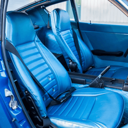 Blue synthetic leather seat covers designed for Datsun 240Z, 260Z, and 280Z models from 1970-1978. These covers offer a perfect fit, enhancing the car's interior with a touch of luxury while providing durable protection against spills and wear.