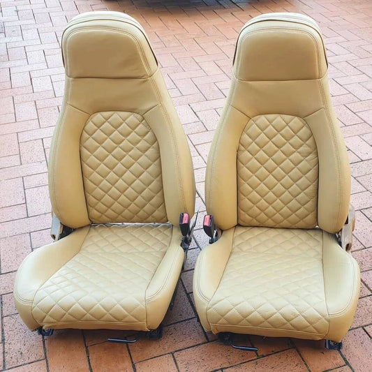 Pair of peanut beige leather Mazda Miata seat covers with diamond stitching, designed as OEM replacements for 1989–2000 NA and early NB models.