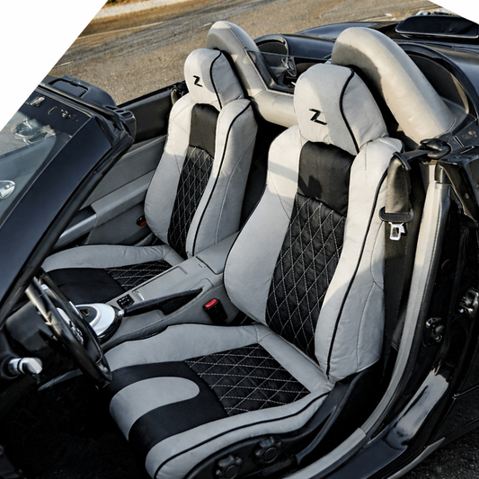 Nissan 350Z replacement leather seat covers in black and white with diamond stitched inserts, custom OEM style upholstery for convertible interior