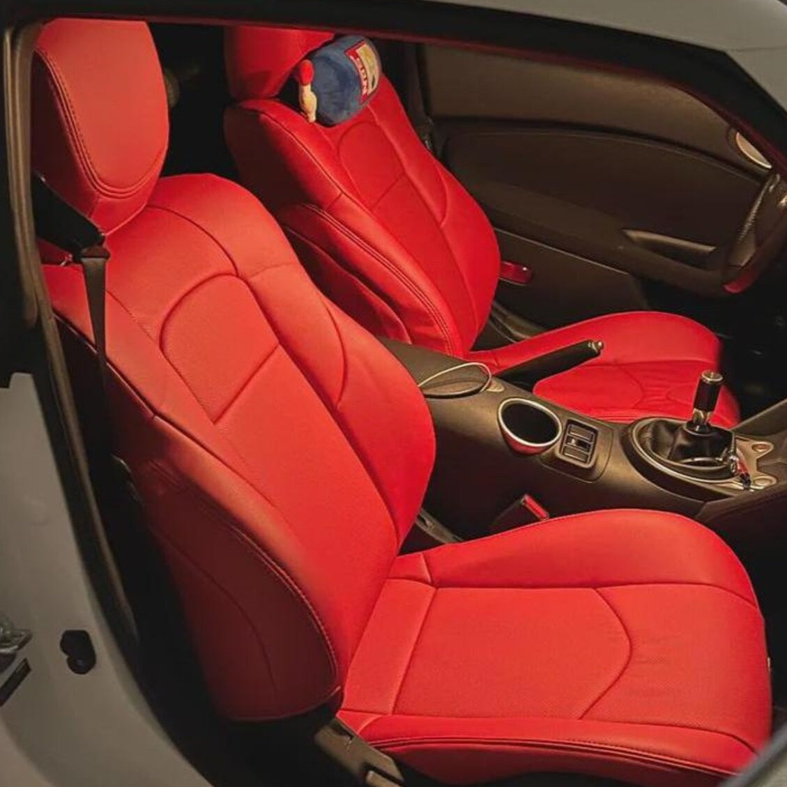 Nissan 370Z (2009–2016) red full-leather replacement seat covers, OEM-fit upholstery kit for cloth manual seats. Similar options from Katzkin, LSeat, and Ridies.