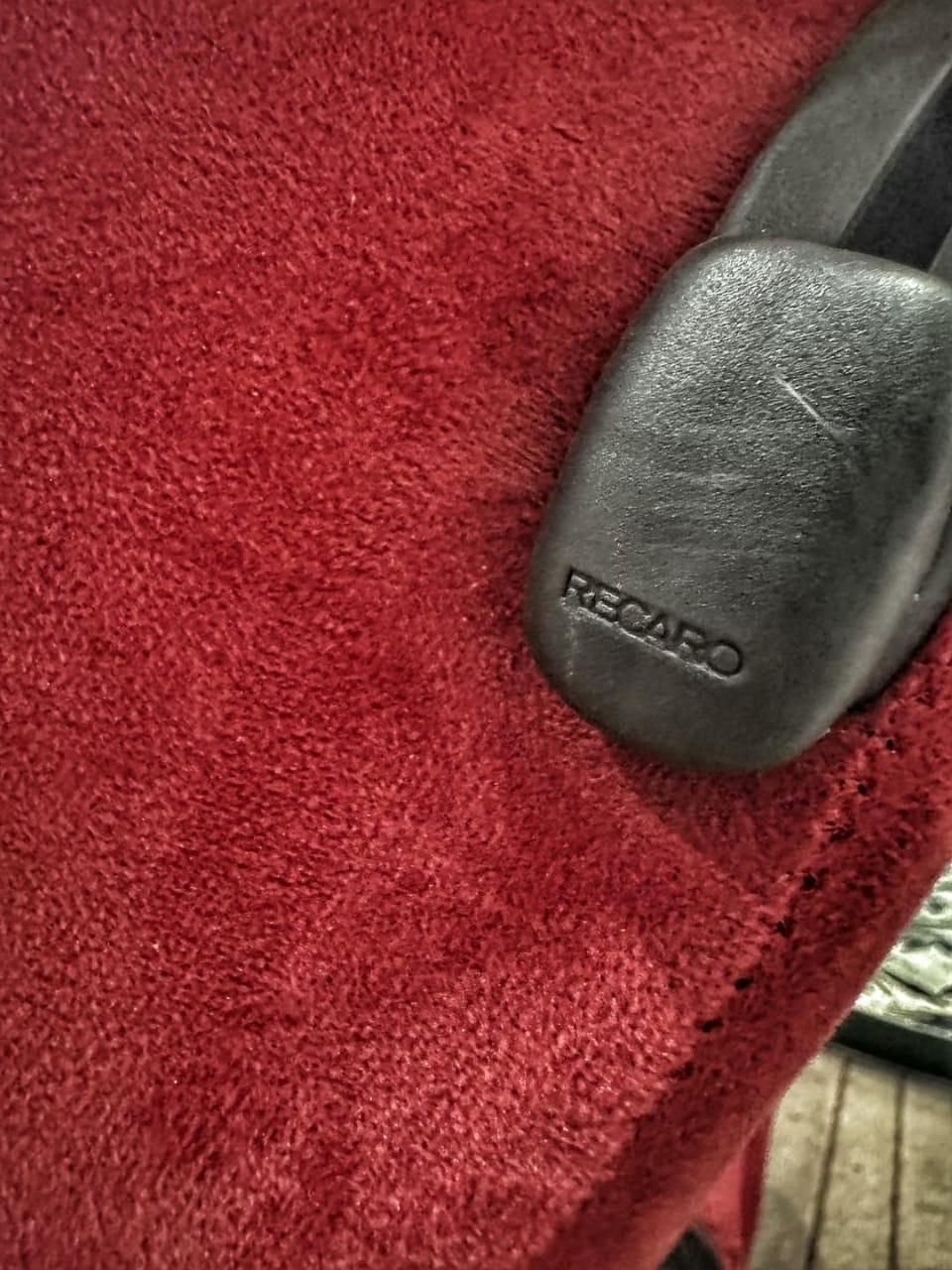 Close-up detail of the Recaro logo on the reclining lever of the SR3 Confetti DC2 Type R bucket seat, showing authenticity and brand quality.